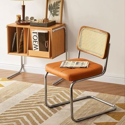 अच्छा दाम सरल आरामदायक ठोस लकड़ी घर भोजन कुर्सी स्टेनलेस स्टील सम्मेलन कैफे रतन अवकाश कुर्सी ऑनलाइन